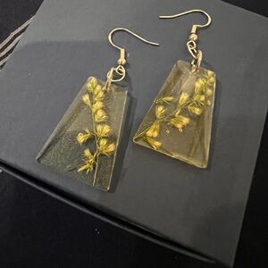 Resin earrings with dried wildflower.